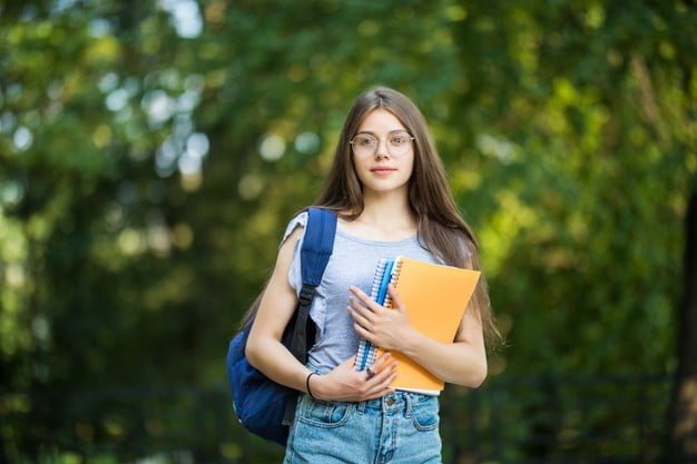 cheerful attractive young woman with backpack notebooks standing smiling park 231208 8088