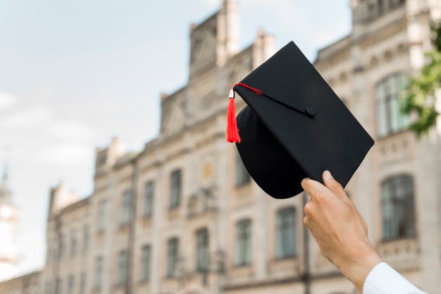 graduation concept with student holding hat 23 2148201873