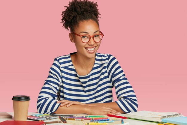 happy ethnic student designer draws sketch university exam wears striped jacket glasses 273609 43976